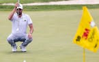 Troy Merritt lines up a shot on the 18th hole during the first round of the 3M Open golf tournament, Thursday, July 22, 2021, in Blaine, Minn. (Carlos