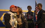 on track: Ashley Mehrwerth gave friend and fellow driver TJ Inderieden a smooch on the cheek after the trophy presentation on victory lane following h