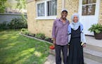 St. Cloud residents Youssouf “Joe” Omar and Hamdia Mohamed stand by a duplex they own as part of their business, Victory Plus Housing.