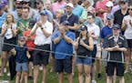 Fans on the 9th hole clapped after a successful putt during the first round of the 3M Open in Blaine. ] CARLOS GONZALEZ • cgonzalez@startribune.com 