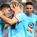 Minnesota United midfielder Emanuel Reynoso, left, celebrated with Chase Gasper after the Loons took a 2-1 lead against Portland on Saturday night.
