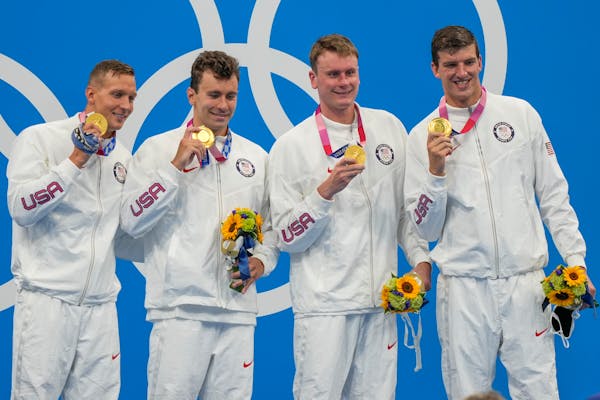 From left, the winning U.S. men’s 4x100 freestyle relay team of Caeleb Dressel, Blake Pieroni, Bowe Becker and Zach Apple.