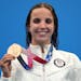 Regan Smith of Lakeville held up her bronze medal for the women’s 100-meter backstroke at the 2020 Summer Olympics on Tuesday.