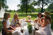 Friends enjoyed a picnic set up by Courtney Smallbeck, owner of Perfect Picnic Co., in Lyndale Park. From left, Sandy Long, Angela Kostel, Nardos Sium