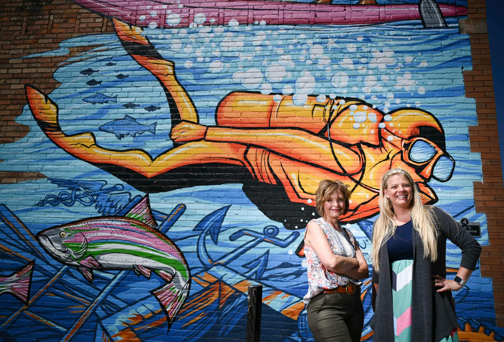 With input and buy-in from Cuyuna Lakes communities, Michelle LeMieur, left, and Johnna Johnson and other residents have led revitilization projects. One of them is public art: eight building murals.