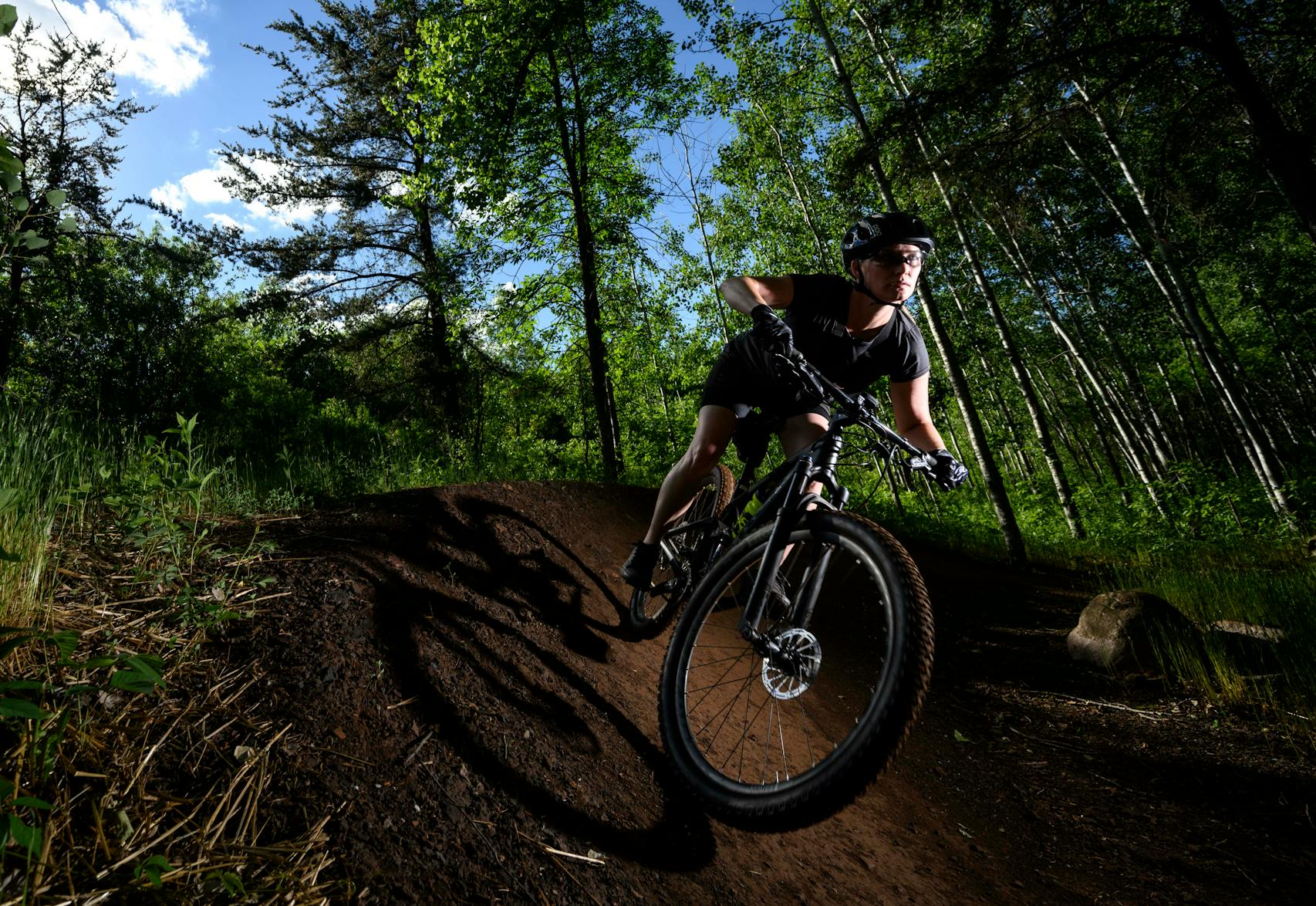 Kate Swanson cut around a berm on Drawpoint Trail in Cuyuna Country State Recreation Area. 