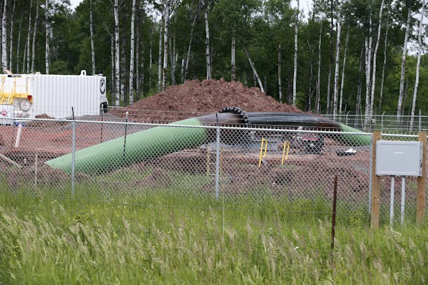 An Enbridge Energy pipeline drilling pad is shown in this June 2018 file photo along a rail line that traces the Minnesota-Wisconsin border near Cloqu