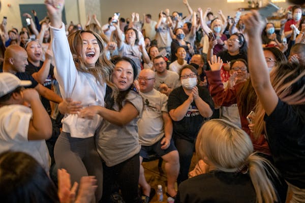 Shyenne Lee, 18, the older sister of St. Paul Olympian Suni Lee, left, reacted alongside Souayee Vang, right, and other family and friends, after Sun 