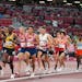 Competitors run in the men’s 10,000-meters final at the 2020 Summer Olympics.