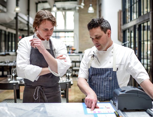 Previous chefs at Spoon and Stable’s Synergy Series include Grant Achatz of Chicago’s Alinea, left, with chef Gavin Kaysen.  Bonjwing Lee