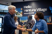 JPMorgan Chase CEO Jamie Dimon said hello Monday to Tsedenya Mengiste, a personal banker at Chase’s Ventura Village branch on East Franklin Ave.