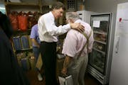 Photo by David Joles  In 2006, U.S. Rep. Jim Ramstad, left, and Hy Rosen, then-director of the Greater Lakes Food Bank, shared a moment following a hu