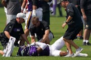 Longtime Vikings trainer Eric Sugarman, above on left, running to care for a player last August, has been replaced by Tyler Williams of the Rams, the 