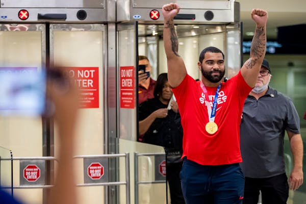 Returning home with a gold medal from the Tokyo Olympics, Gable Steveson greeted fans after arriving at Minneapolis-St. Paul International Airport on 