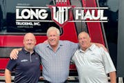 CEO Jason Michels; founder John Daniels and employee-owner driver Jeff Bolstad of Long Haul Trucking.