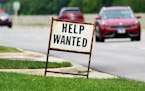 A help wanted sign is displayed at a gas station in Mount Prospect, Ill., Tuesday, July 27, 2021.