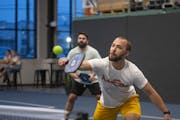 Zach Peterson returned a shot as he and Matthew Reid played in the pickleball league hosted by Minneapolis Cider Co.