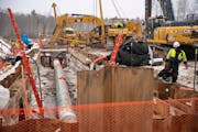 Shown are workers a year ago laying Enbridge’s Line 3 pipeline along the Fond du Lac reservation in Cloquet, Minn.