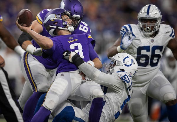 Indianapolis Colts defensive end Ben Banogu (52) forced an incomplete pass by Minnesota Vikings quarterback Jake Browning (3) in the second quarter.