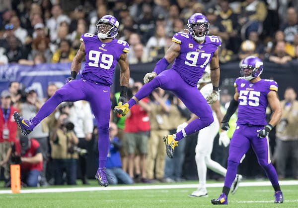 Vikings defensive ends Danielle Hunter, left, and Everson Griffen celebrated during the team’s playoff win over the Saints in 2020.