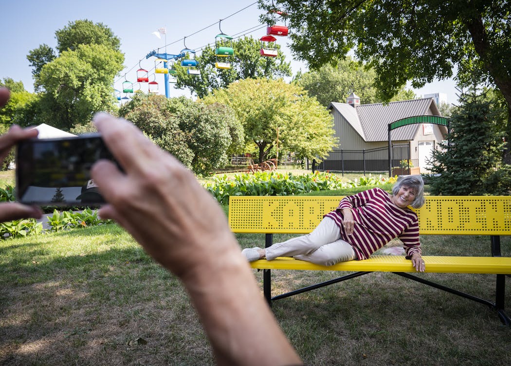 Karen Landin — who treats her entire family, which includes children, grandchildren and great-grandchildren, to the fair every year — posed for a photo on her new bench, a surprise gift from her family.