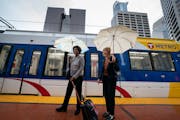 Sen. Tina Smith, right, and Nuria Fernandez, head of the Federal Transit Administration, boarded a light-rail train to the Target Field stop for a tra