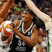 Lynx center Sylvia Fowles went to the basket between Seattle center Mercedes Russell and forward Breanna Stewart in the second quarter Tuesday night a
