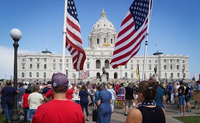 A crowd filled the Minnesota State Capitol lawn last August during a rally against COVID vaccinations and mask mandates.