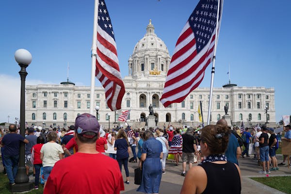 A crowd filled the Minnesota State Capitol lawn last August during a rally against COVID vaccinations and mask mandates.