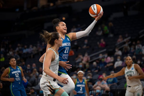 Lynx guard Kayla McBride shot while outrunning the defense of New York Liberty guard Rebecca Allen in the first quarter.