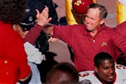 Glen Mason, the Gophers head coach in 2000, gets a high-five from a fan after the last time Minnesota defeated Ohio State. The Buckeyes have won the l