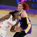 Washington star Tina Charles, here driving against Los Angeles’ Amanda Zahui B, has had an outstanding season, but she has been sidelined since Aug.