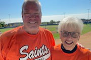 Dick Bremer with Darlys Forcier, his fourth grade teacher in Dumont, Minn. They were supporting Dumont Saints on Saturday in Waconia in the state amat