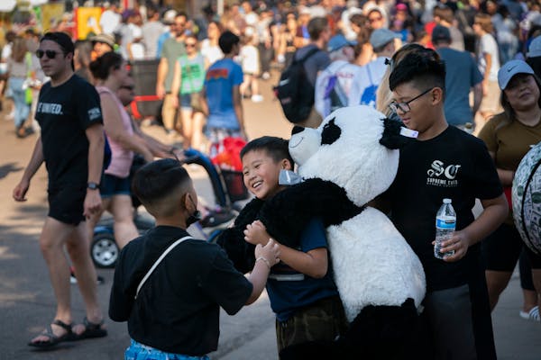 From the left; Poseidon Thao, 8, Chance Yang, 9, and Evann Gonzalez, 10, enjoyed the last day of the Minnesota State Fair on Monday in Falcon Heights.