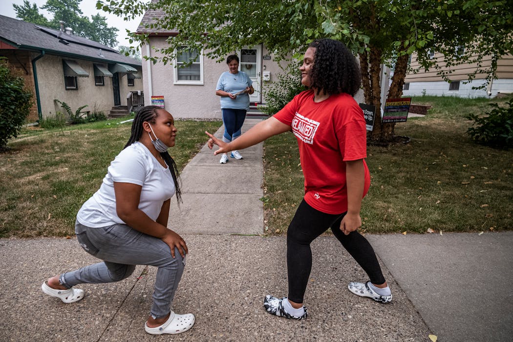 Ogi Carter, her daughter, Olivia, 12, right, and friend, Janiyah Mallory live in the Folwell neighborhood, where reported gunfire has more than doubled from average.