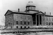 The first capitol building in Minnesota was this structure erected in 1853 at what is now the corner of Tenth and Wabasha streets. First occupied on J