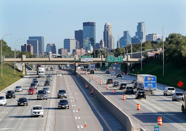 Traffic flowed in all lanes in both directions on the newly reopened I-35W as seen from the 40th St. pedestrian bridge Friday in Minneapolis.
