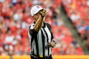 Shawn Hochuli, the referee during Thursday’s season opener between Tampa Bay and Dallas, makes a call during the first half of a preseason game bet