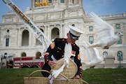 A Marine sergeant set free two baskets full of doves at the 9/11 Day of Remembrance ceremony at the Minnesota State Capitol on Saturday.