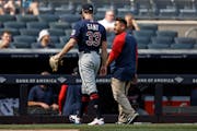 Twins starter John Gant walked off the field with trainer Michael Salazar, leaving after only 12 pitches because of a lower abdominal strain against t
