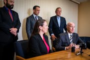 Thomas Plunkett, bottom right, attorney for former Minneapolis police officer Mohamed Noor, spoke at his office with his team of lawyers about the Min