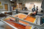 Cole Rogers, who founded Highpoint Center for Printmaking with Carla McGrath, worked on the proofing process for a screen print by artist Julie Mehret
