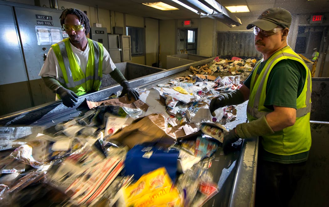 Workers on the sort line at Dem-Con's recycling facility in Shakopee in 2015.