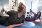 Nell Hurley, right, led Megan Vanderbilt through a strength training circuit at her in-home studio.