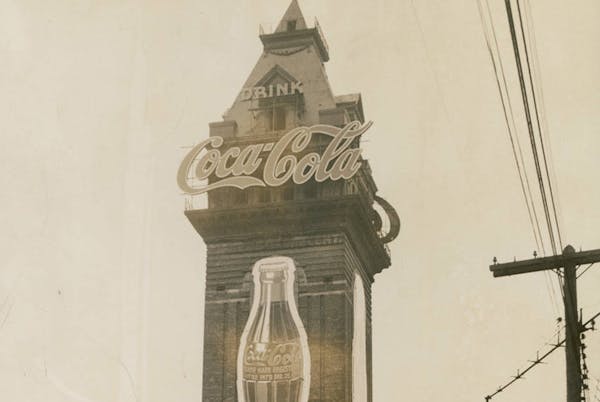 The tower of the old Exposition Building featured neon-lit, 54-foot bottles of Coke beneath the word “Coca-Cola” in 16-foot script lettering.