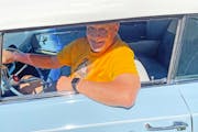 Paul Krause, seated in his powder blue convertible, is still looking good after all these years.