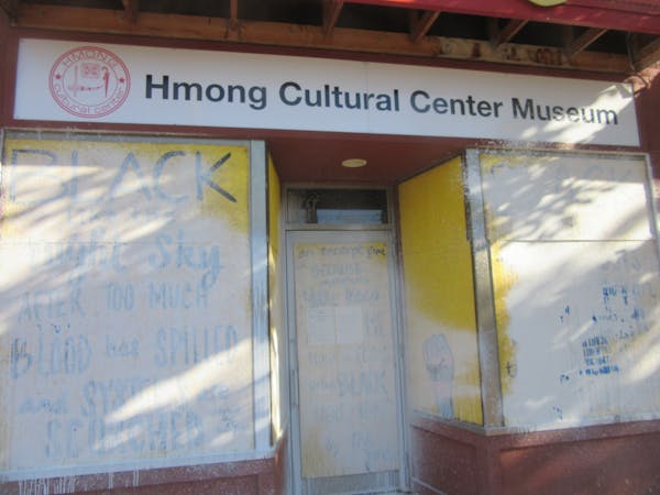 Scrawled on white paint at the Hmong Cultural Center in St. Paul was “Life, Liberty, Victory,” associated with white nationalists.