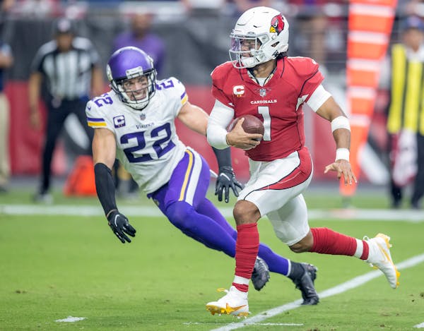 Arizona quarterback Kyler Murray drove past Vikings safety Harrison Smith for a touchdown in the second quarter.