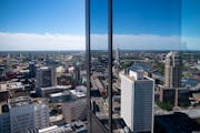 The Minneapolis skyline is reflected on the RBC Gateway tower. Steve Cramer, chief executive of the Minneapolis Downtown Council, said plans to bring 