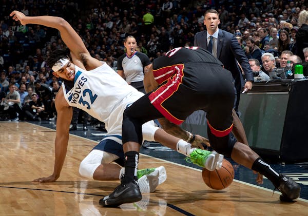 Karl-Anthony Towns of the Wolves and Miami’s Chris Silva fought for the ball during an NBA game on Oct. 27, 2019 at Target Center. Silva signed with